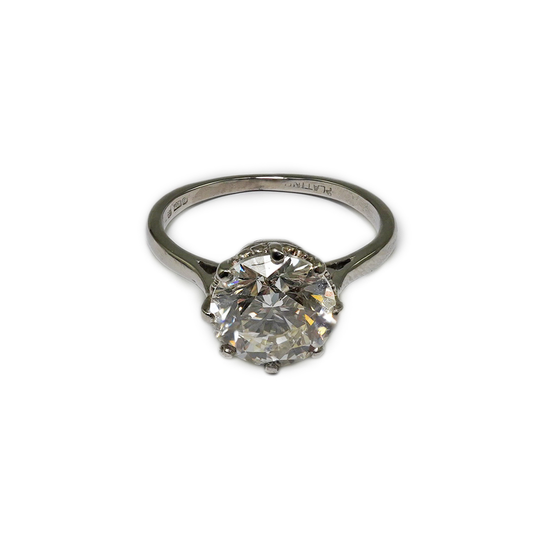 A platinum and solitaire diamond set ring